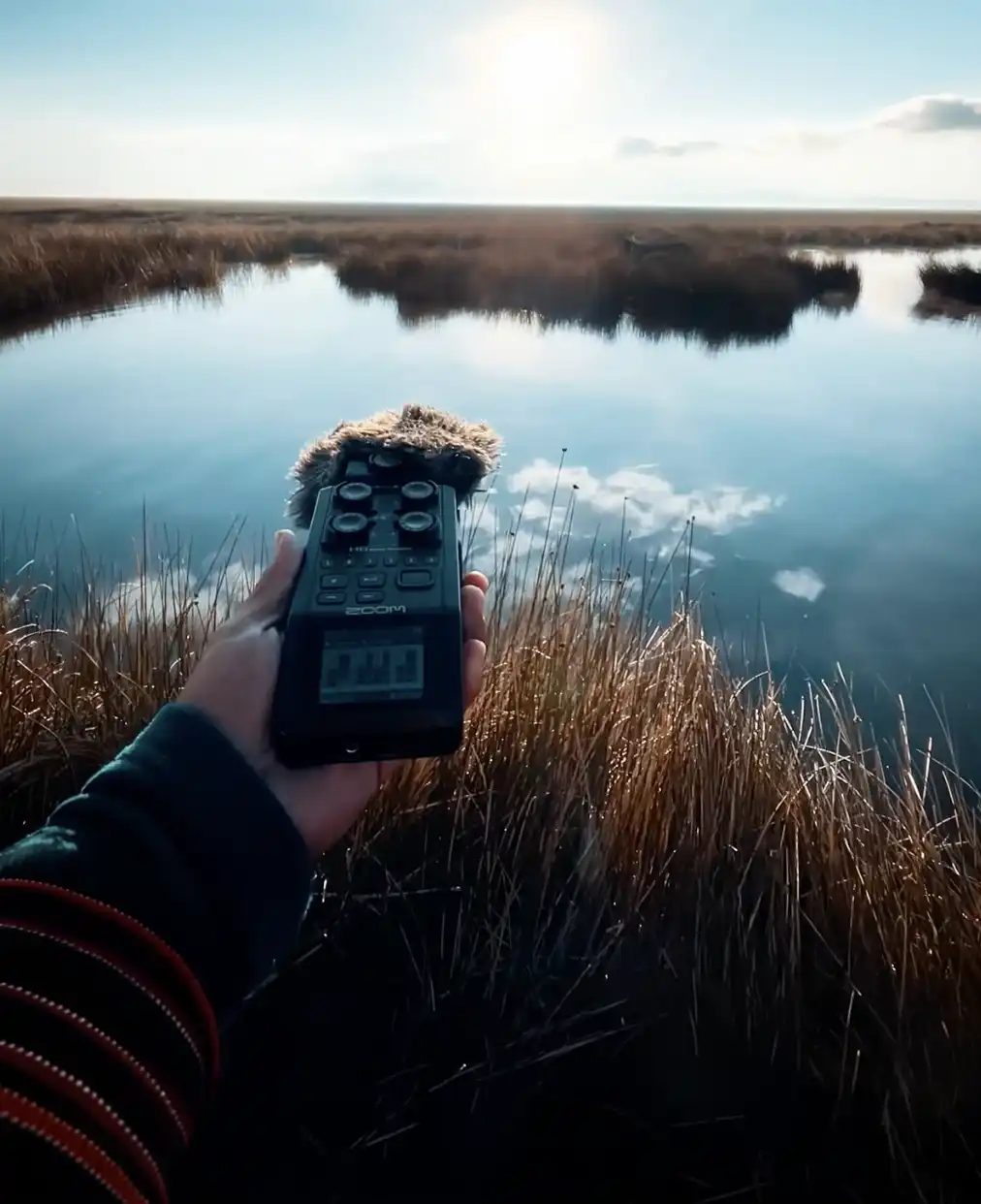 Recording ambient sounds at Lake Titicaca. Photo: Tayta Bird.