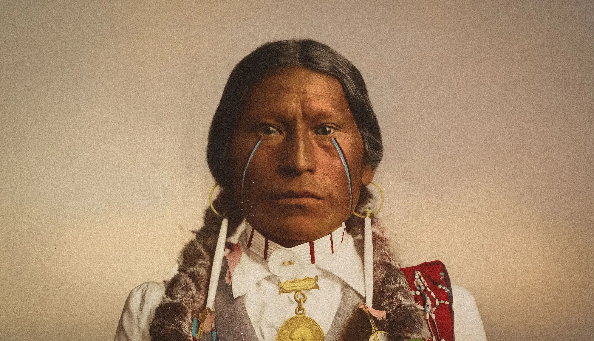 Jicarilla Apache chief wearing the peace medal of President James A. Garfield, 1899. His eye shape is inherited from the peoples who crossed over from Siberia thousands of years ago. Source: The Metropolitan Museum of Art.